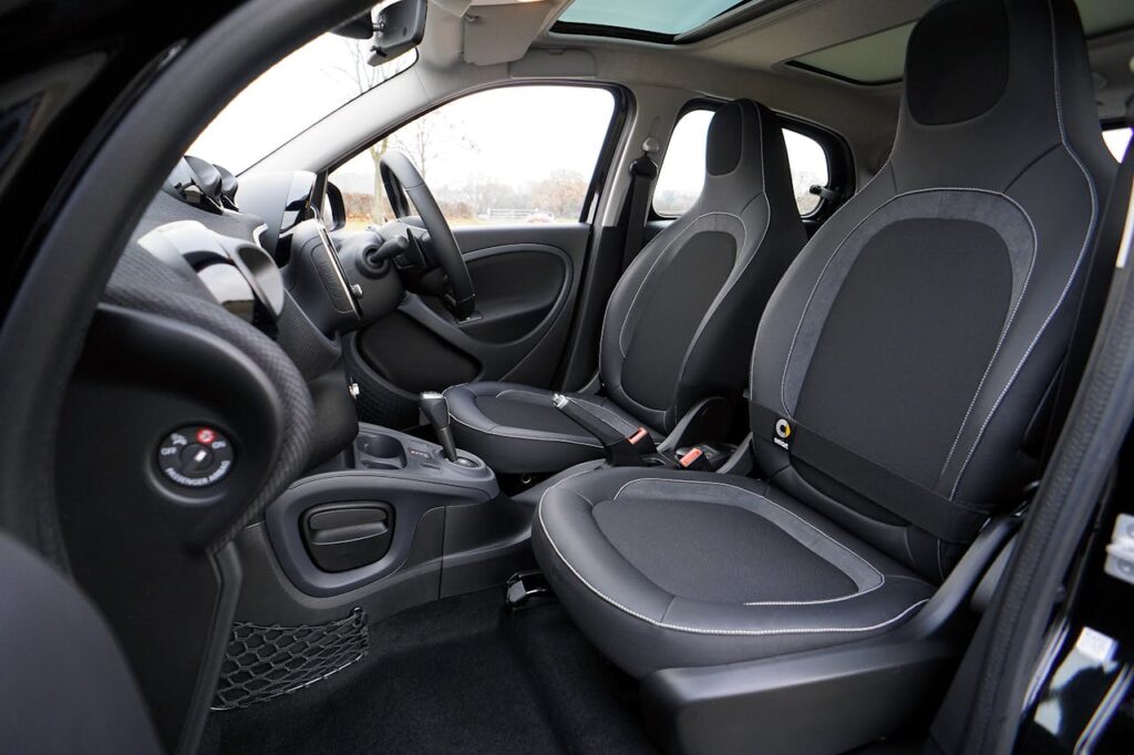 pexels-photo-244818 Explore the sleek interior of a modern luxury car featuring leather seats and advanced technology.